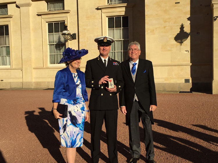 PO Mark Lambert MBE, parents at Buckingham Palace