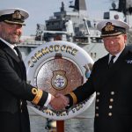 Commodore Paul Halton hands to Commodore Rob Bellfield