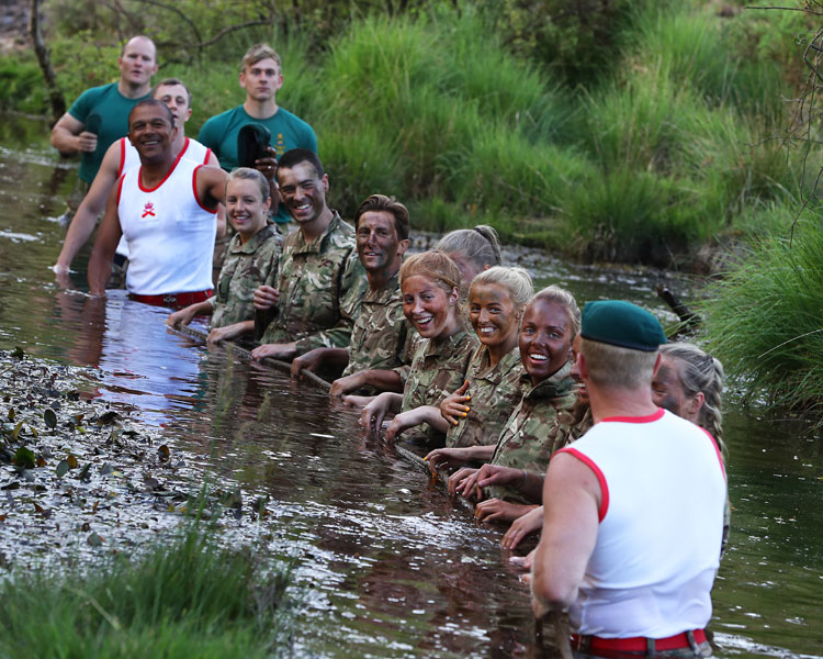The England Under 20s Women’s Football squad train with the Royal Marines