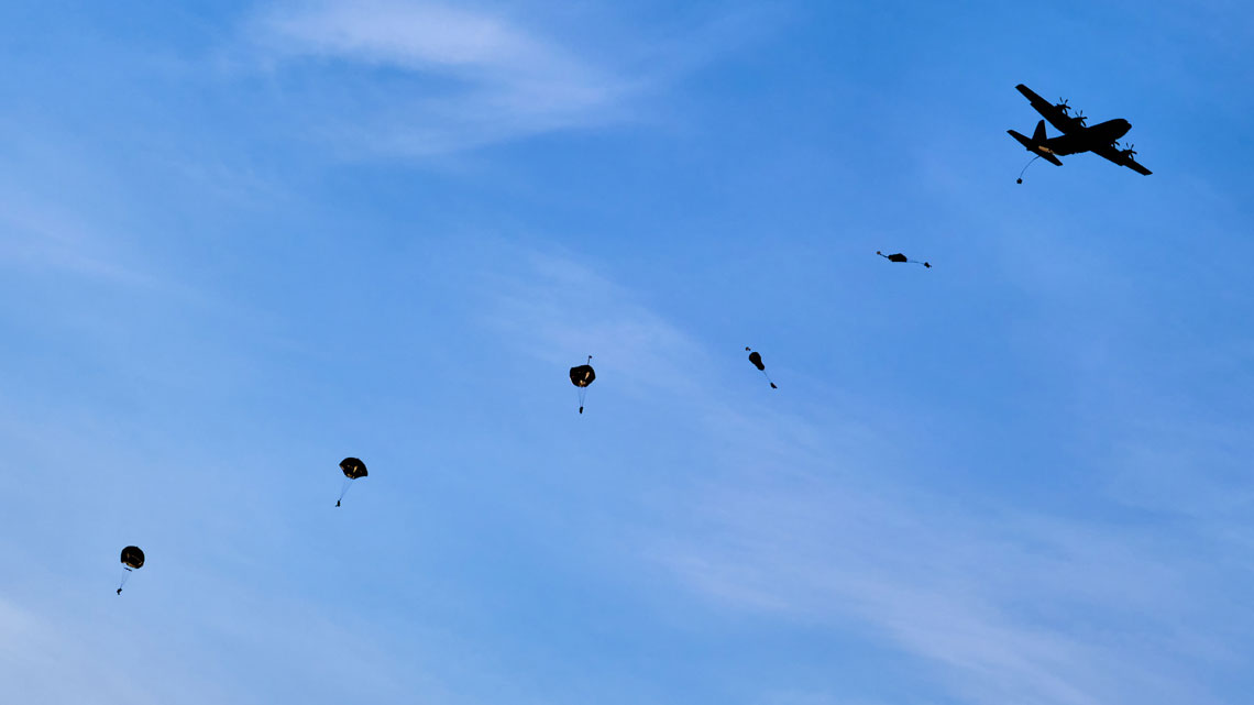 Royal Marines parachute deep behind enemy lines with American forces