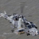 Royal Navy Wildcat helicopter fires the new Martlet missile