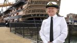 Commodore Terry in front of HMS Victory
