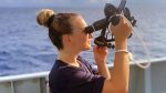 Cadet Scarlett Barnett-Smith taking a navigational fix aboard HMS Tamar