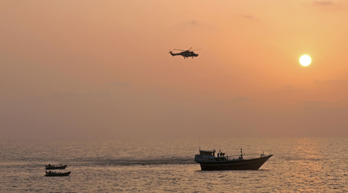 HMS Montrose Wildcat helicopter and Sea Boats strike at the dhow at dawn