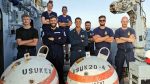 Team HMS Bangor show off some of the recovered practice mines