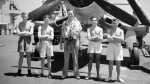Air and ground crew of 1833 NAS in front of a Corsair aboard HMS Illustrious