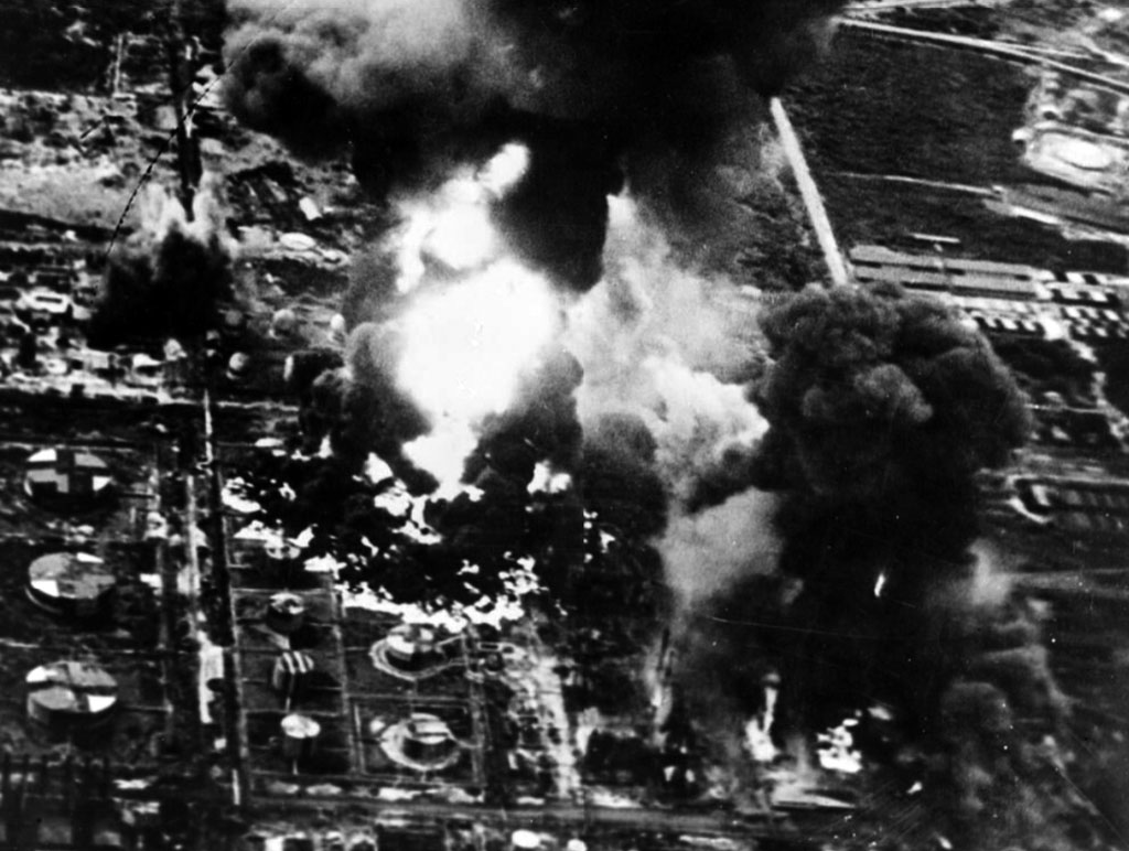 The oil tanks at Palembang are engulfed in smoke
