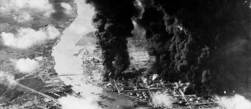 Dense black smoke rises from Palembang after a raid