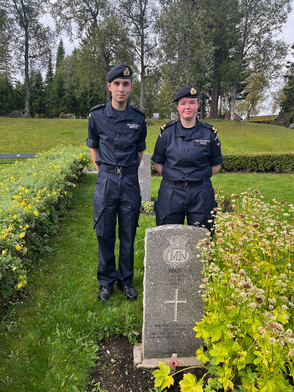 Third Officer Izzy Vince and Cdt Griffiths at the grave of Apprentice Pounder