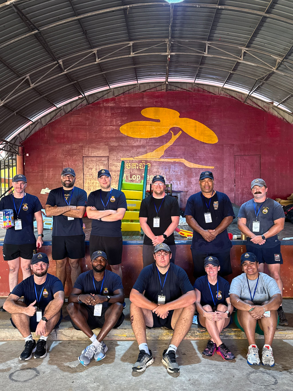 Sailors and volunteers at the Mlop Tapang community project for young people